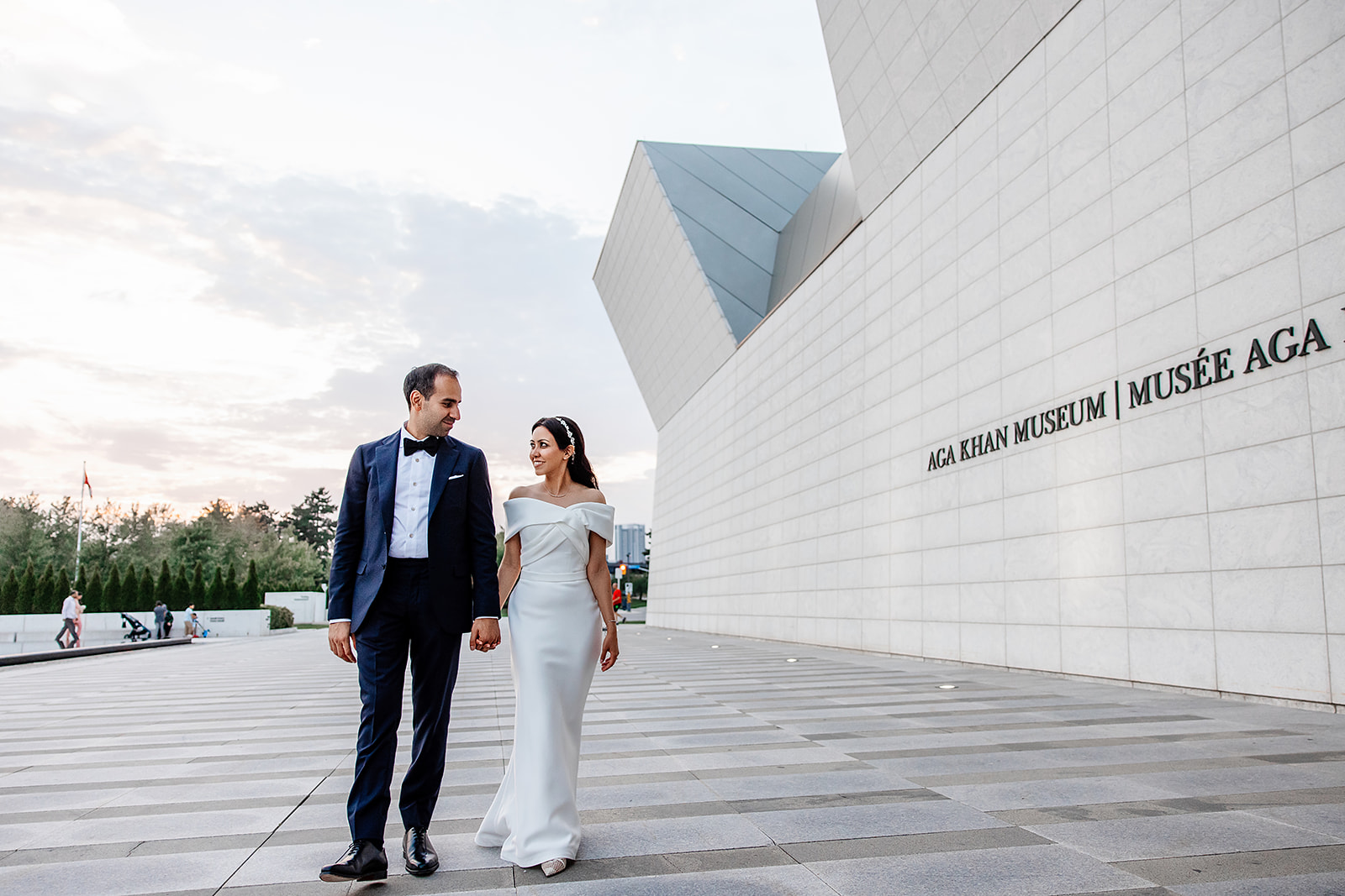 Toronto wedding couple sharing intimate moment at Aga Khan Museum outdoor courtyard